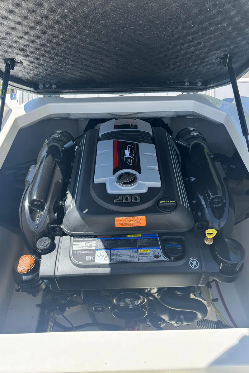 Slide: The Image of Engine compartment of 2024 Chaparral 21 SSi boat, powerful engine. - 35