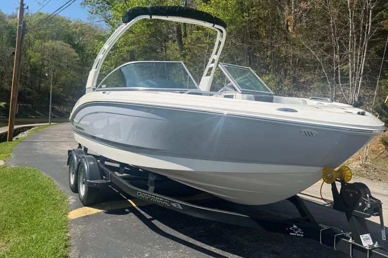 Slide: The Image of 2024 Chaparral 21 SSi boat parked on trailer outdoors. - 4