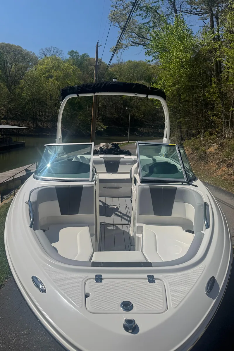 Slide: The Image of 2024 Chaparral 21 SSi boat parked on a road. - 5