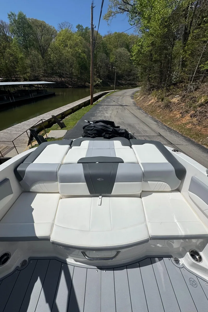 Slide: The Image of 2024 Chaparral 21 SSi boat with spacious deck and seating area. - 8