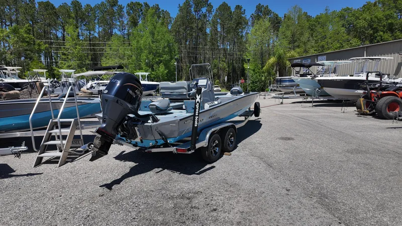 Slide: The Image of 2025 Xpress H22B boat on trailer in outdoor dealership lot. - 19