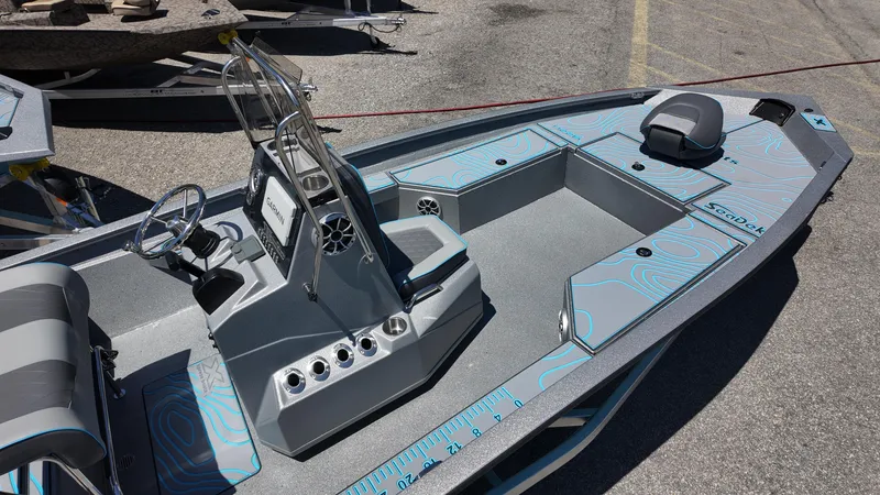 Slide: The Image of 2025 Xpress H22B boat with sleek design and modern features, docked outdoors. - 23