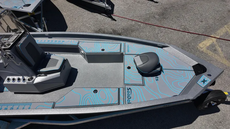 Slide: The Image of 2025 Xpress H22B boat with sleek design and modern features, viewed from above. - 25