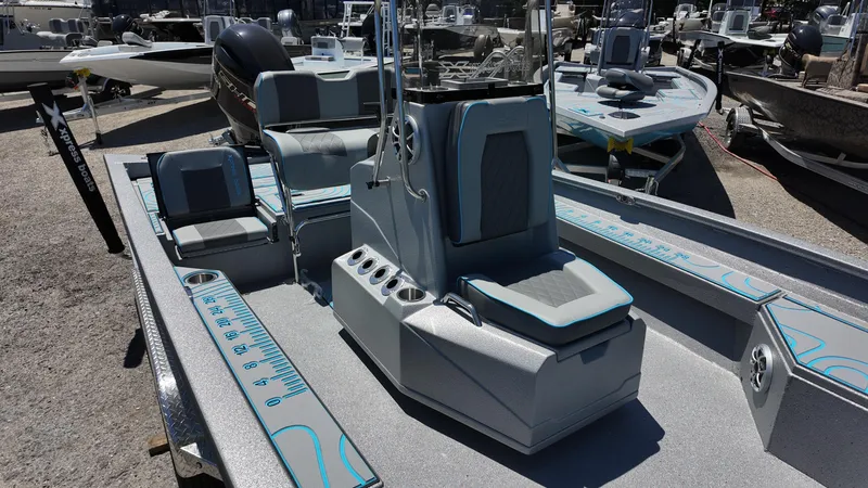 Slide: The Image of 2025 Xpress H22B boat with center console and seating, displayed outdoors. - 26