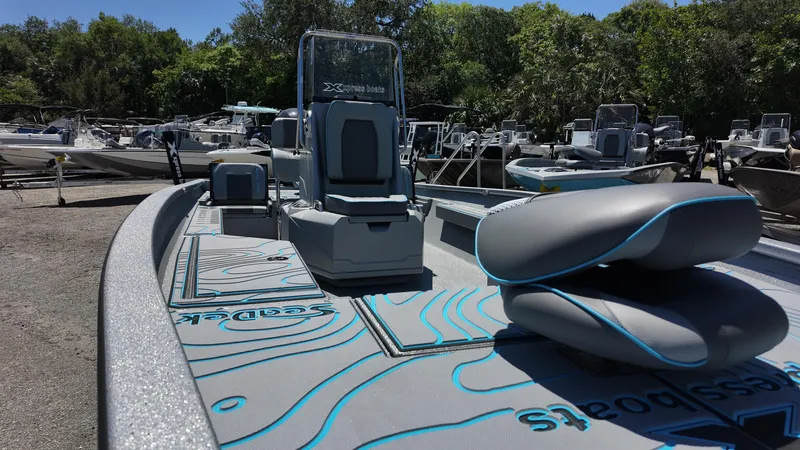 Slide: The Image of 2025 Xpress H22B boat with sleek design, modern seating, and detailed deck graphics. - 27