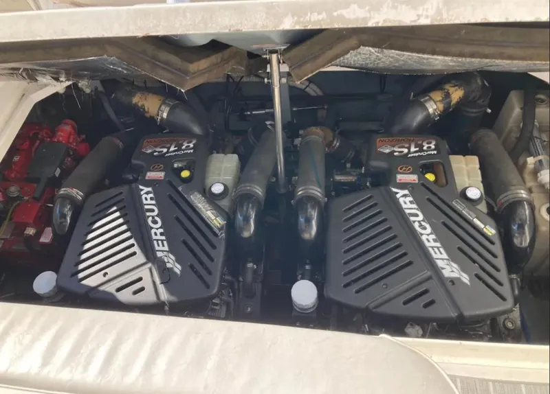 Slide: The Image of Twin Mercury engines in a 2002 Sea Ray 340 Sundancer boat. - 12