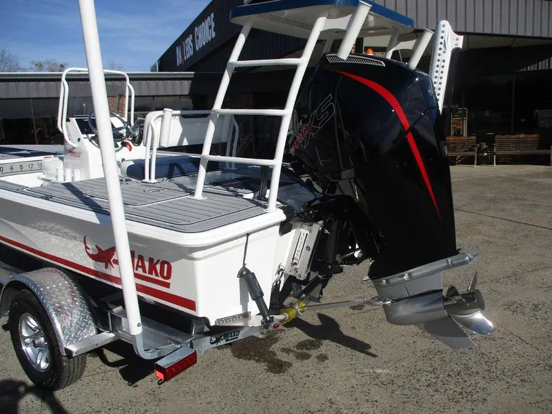 Slide: The Image of 2025 Mako 18 Pro Skiff Patriot Edition boat with powerful outboard motor. - 3