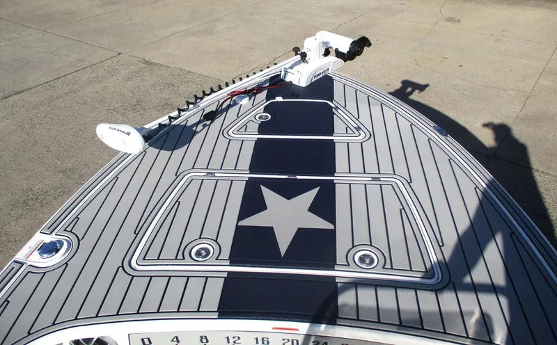 Slide: The Image of 2025 Mako 18 Pro Skiff Patriot Edition with star design on deck. - 8