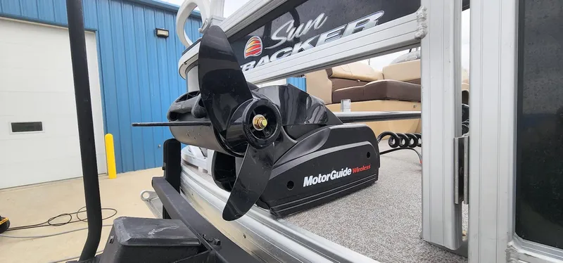 Slide: The Image of 2018 Sun Tracker Fishin' Barge 20 DLX with MotorGuide trolling motor, docked near blue building. - 4