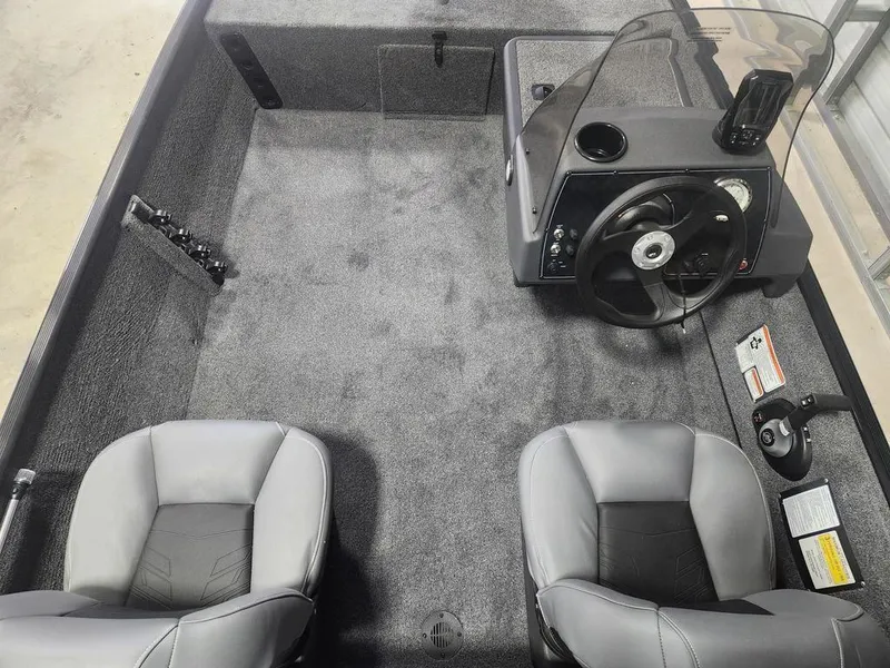 Slide: The Image of 2025 Tracker BASS TRACKER® Classic XL boat interior with steering console and seating. - 5