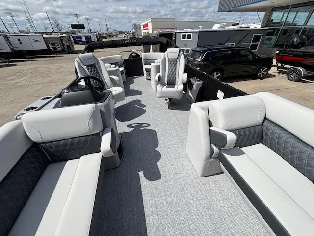 Slide: The Image of 2025 Harris Sunliner 230 pontoon boat with luxurious seating and modern design. - 11