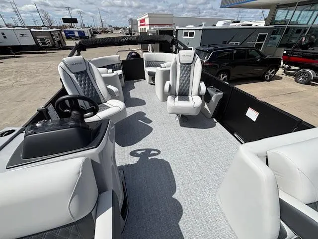 Slide: The Image of 2025 Harris Sunliner 230 pontoon boat with luxurious seating and modern design. - 12
