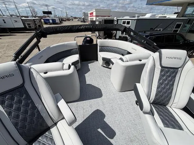 Slide: The Image of 2025 Harris Sunliner 230 pontoon boat with luxurious seating and modern design. - 14