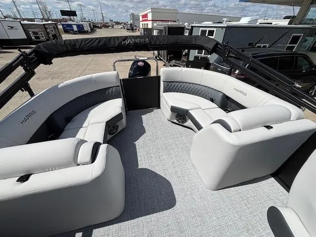 Slide: The Image of 2025 Harris Sunliner 230 pontoon boat with spacious seating and modern design. - 15