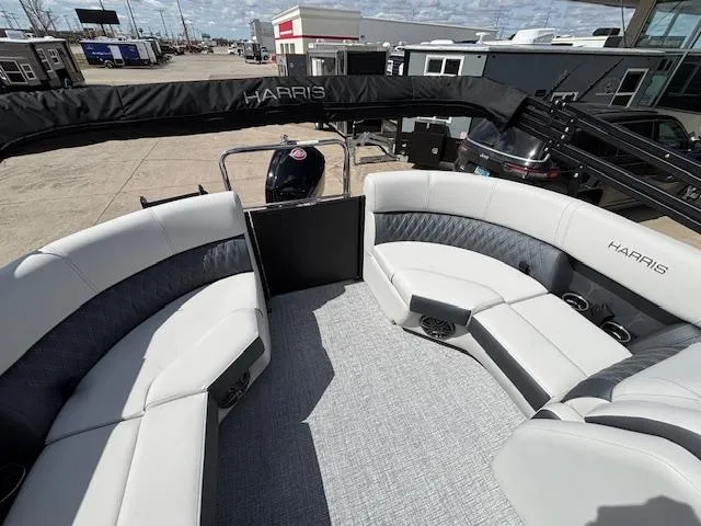 Slide: The Image of 2025 Harris Sunliner 230 pontoon boat with spacious seating and modern design. - 16
