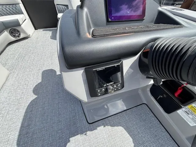 Slide: The Image of 2025 Harris Sunliner 230 boat dashboard with modern controls and sleek design. - 27