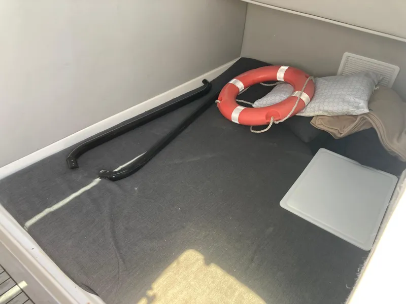 Slide: The Image of Interior of 2014 Insetta i45C boat with life preserver and accessories. - 15