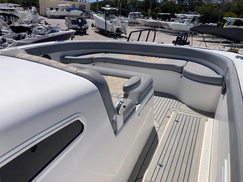 Slide: The Image of 2014 Insetta i45C boat interior with cushioned seating and sleek design. - 18