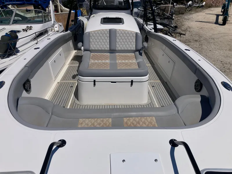 Slide: The Image of 2014 Insetta i45C boat interior with cushioned seating and spacious deck layout. - 21