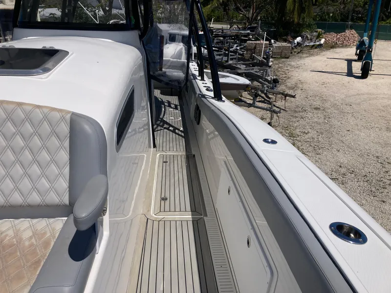 Slide: The Image of 2014 Insetta i45C boat interior with seating and deck details. - 24