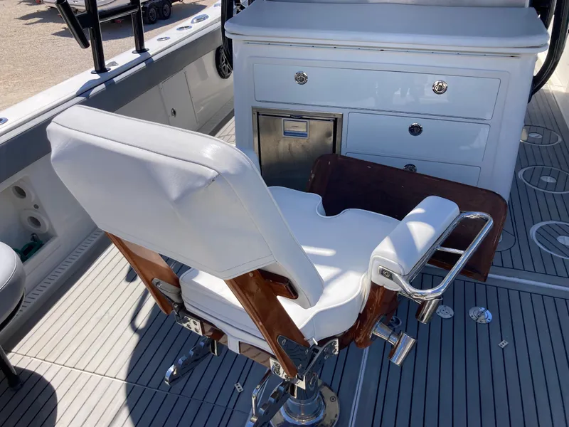 Slide: The Image of Luxury seating on 2014 Insetta i45C boat with white upholstery and wooden accents. - 4
