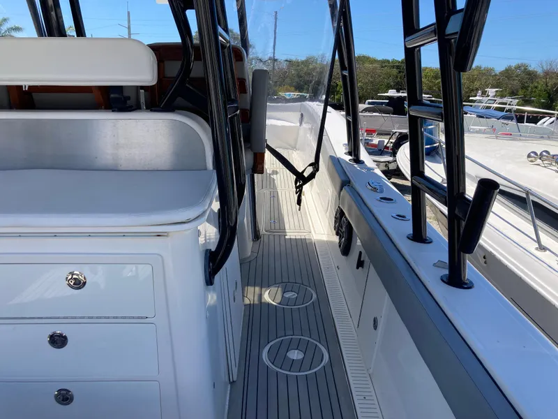 Slide: The Image of 2014 Insetta i45C boat interior with seating and storage compartments. - 8