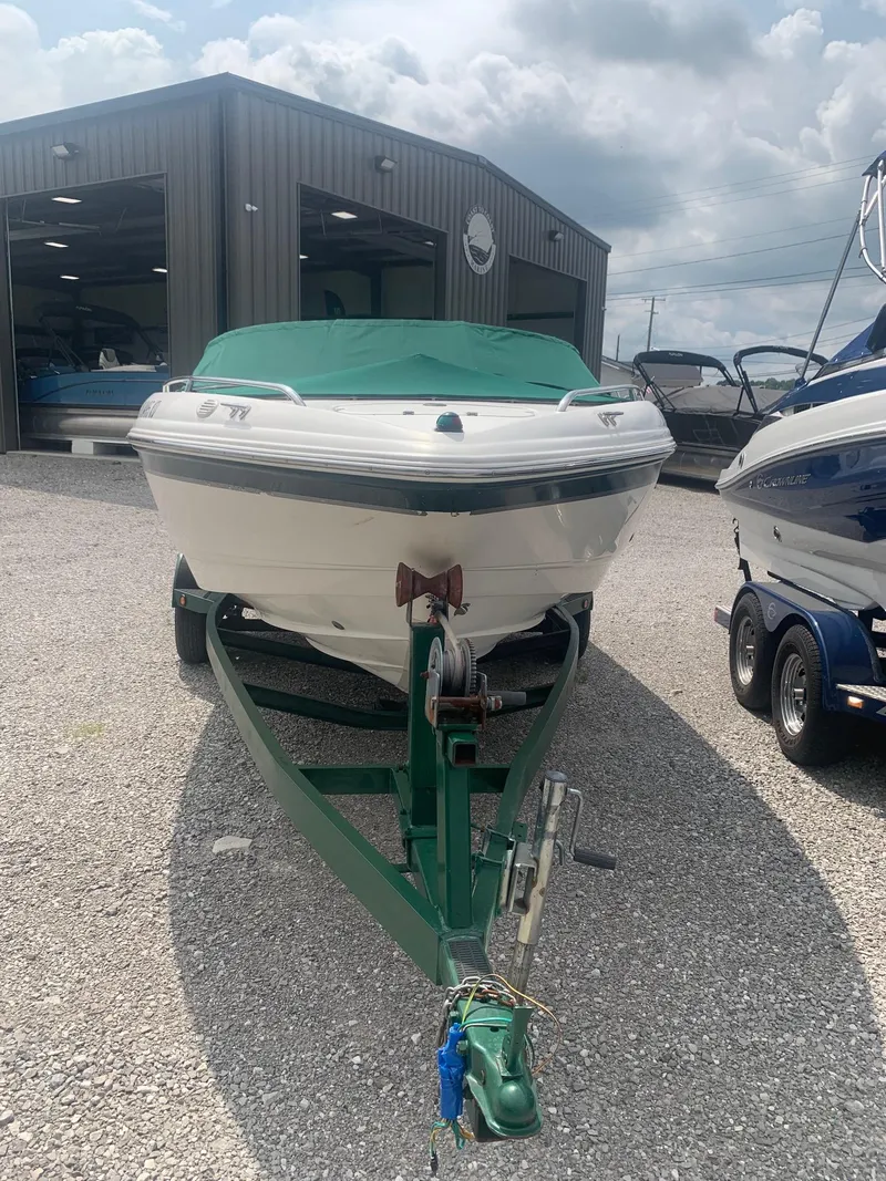 Slide: The Image of 2000 Chaparral 196 SSi boat on trailer, parked outside a storage facility. - 1