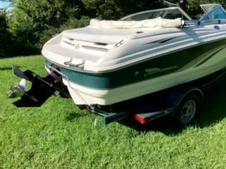 Slide: The Image of 2000 Chaparral 196 SSi boat on trailer, parked on grass. - 12