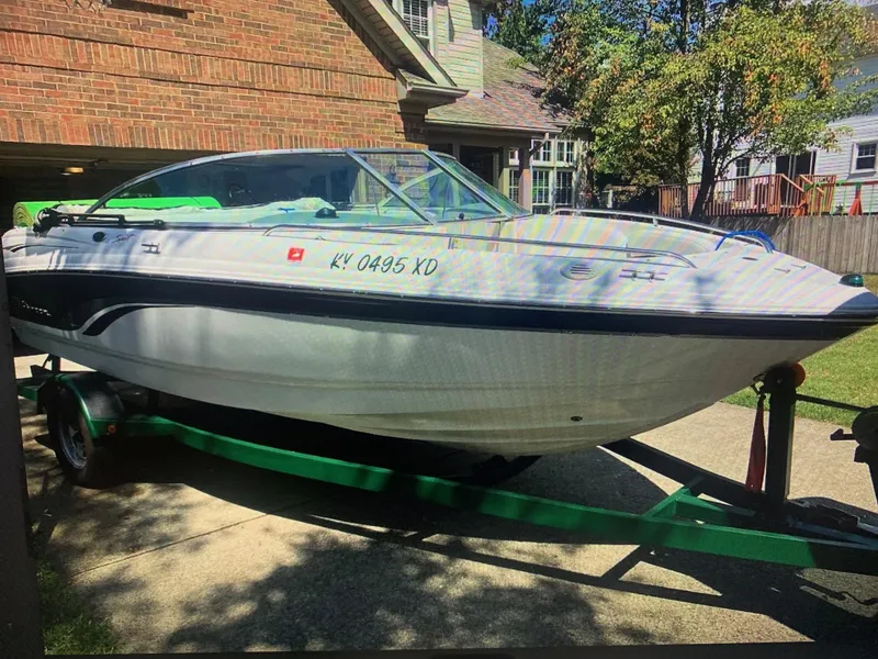Slide: The Image of 2000 Chaparral 196 SSi boat on trailer in residential driveway. - 7