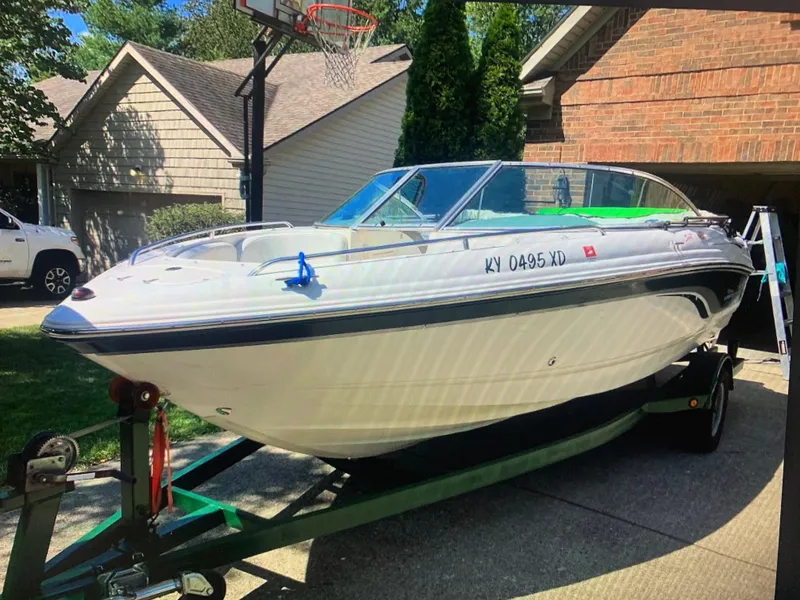 Slide: The Image of Chaparral 196 SSi 2000 boat on trailer in residential driveway. - 8