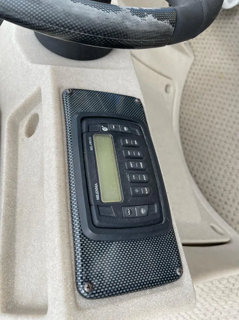 Slide: The Image of Control panel of a 2014 Grand Island 2085 QF boat with digital display and buttons. - 10