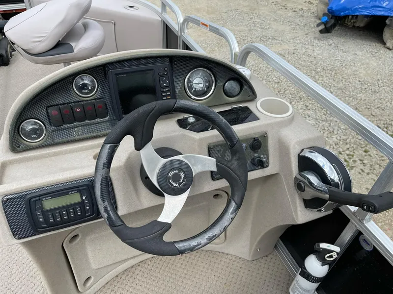 Slide: The Image of Steering console of 2014 Grand Island 2085 QF boat with controls and gauges. - 12