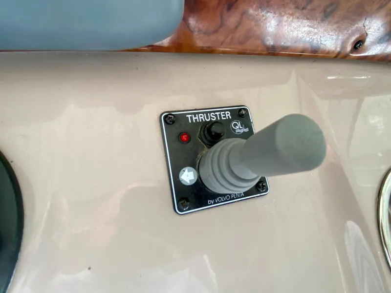 Slide: The Image of Thruster control panel on 2006 Rinker 360 Fiesta Vee boat dashboard. - 16
