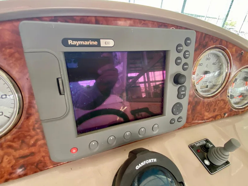 Slide: The Image of Control panel of 2006 Rinker 360 Fiesta Vee with Raymarine display and gauges. - 18