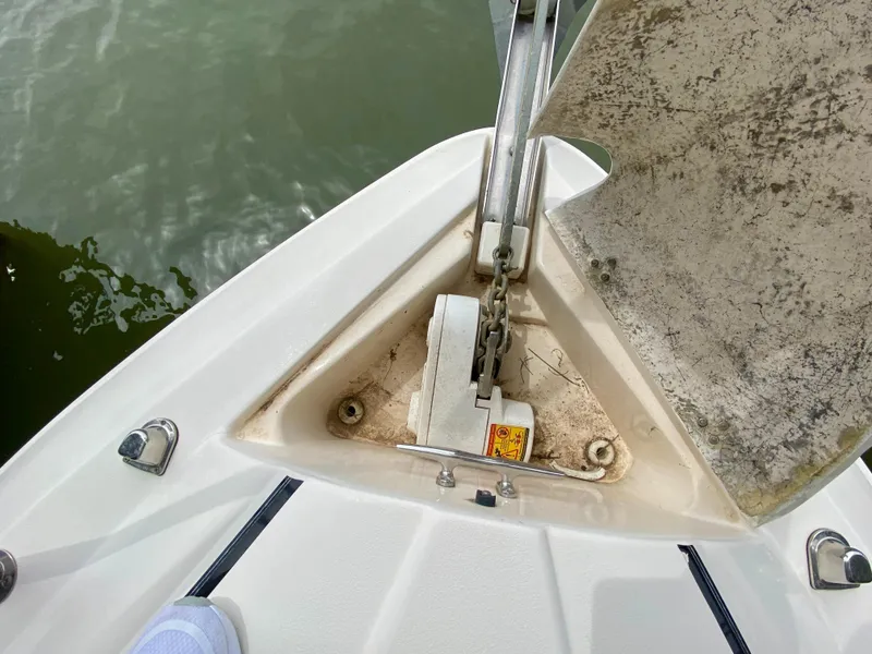 Slide: The Image of 2006 Rinker 360 Fiesta Vee boat anchor system on deck, near water. - 20