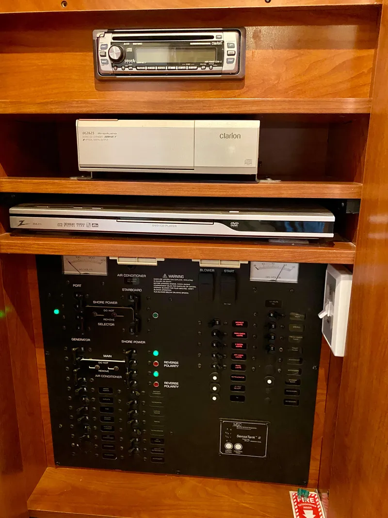 Slide: The Image of Control panel and electronics in a 2006 Rinker 360 Fiesta Vee boat. - 35