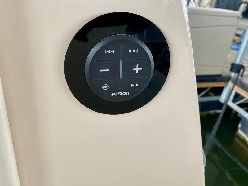 Slide: The Image of Control panel on 2006 Rinker 360 Fiesta Vee boat, featuring Fusion audio system. - 43