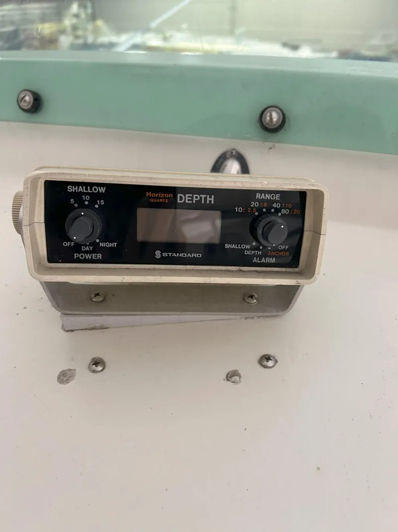 Slide: The Image of Depth gauge on a 1977 Bertram 42 Motor Yacht dashboard. - 14