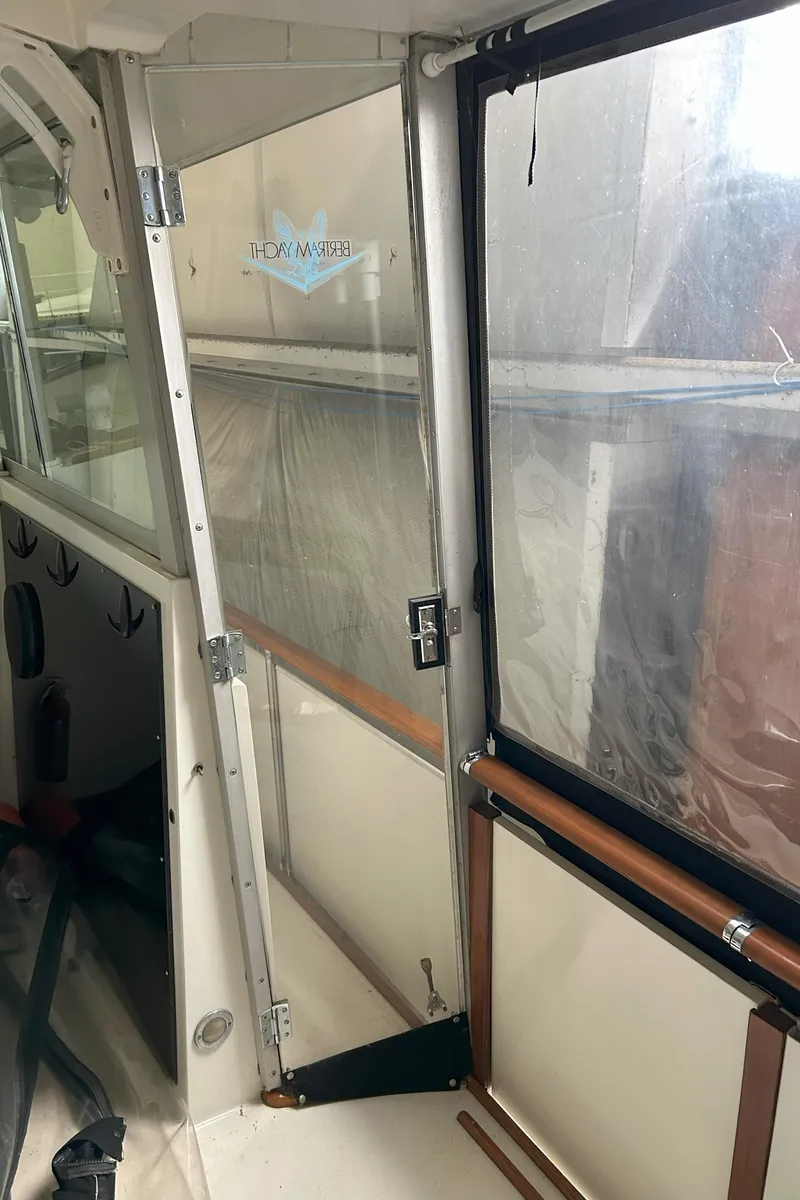 Slide: The Image of 1977 Bertram 42 Motor Yacht interior with clear panels and wooden accents. - 20