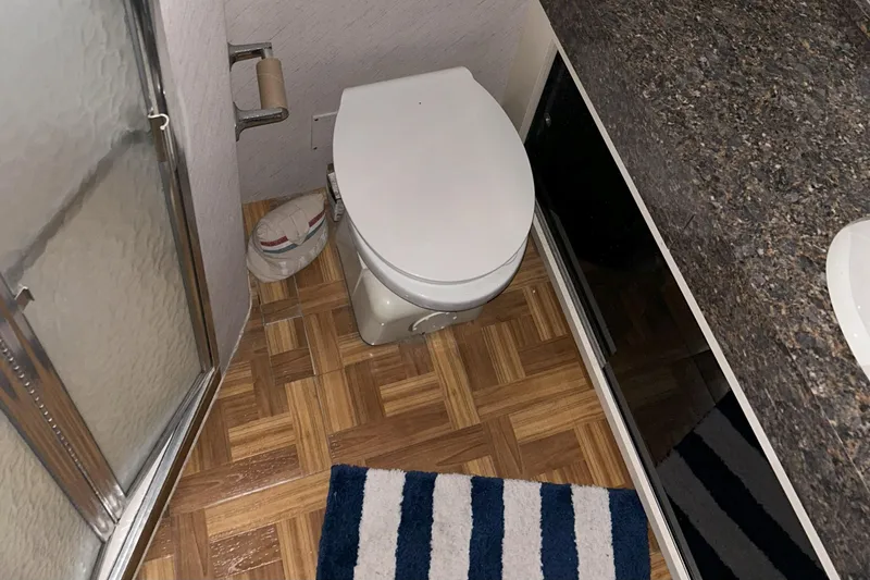 Slide: The Image of Bathroom interior of a 1977 Bertram 42 Motor Yacht with parquet flooring. - 51
