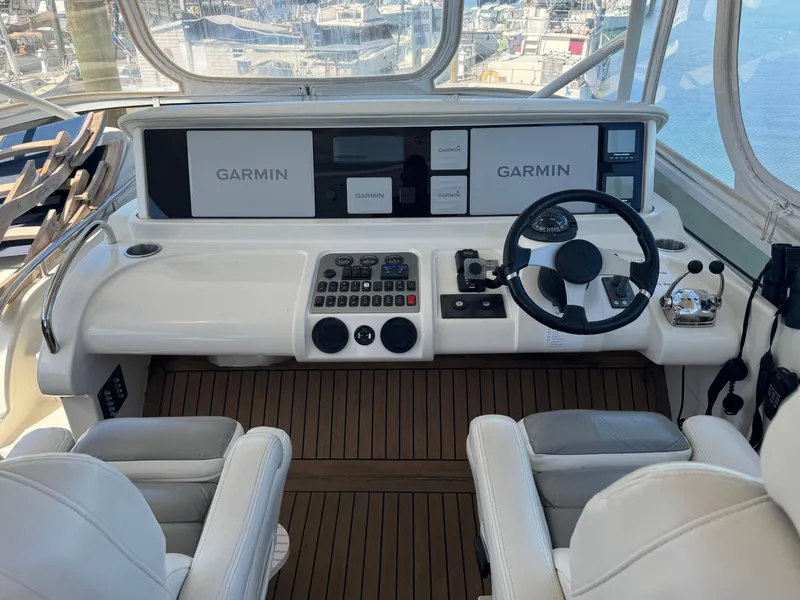 Slide: The Image of Helm of 2007 Marquis 55 Motor Yacht with Garmin navigation system and dual captain chairs. - 40