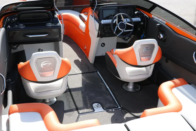 Slide: The Image of Interior of 2022 Crownline 220 SS LPX boat with orange and white seating. - 14