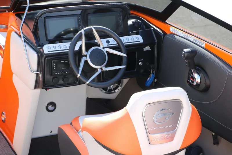 Slide: The Image of 2022 Crownline 220 SS LPX boat dashboard with steering wheel and controls. - 15