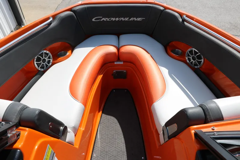 Slide: The Image of 2022 Crownline 220 SS LPX boat interior with orange and white seating. - 19