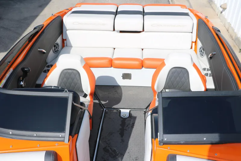Slide: The Image of 2022 Crownline 220 SS LPX boat interior with orange and white seating. - 20