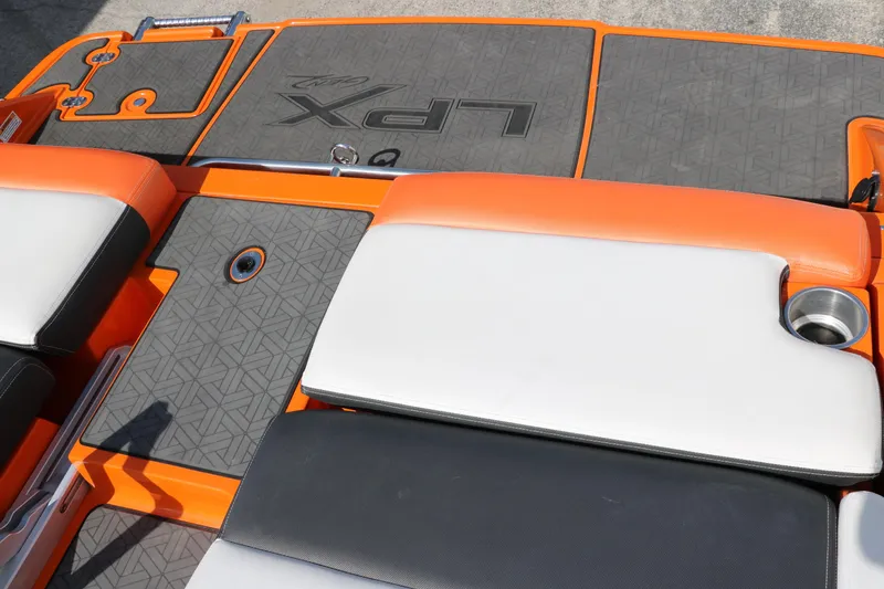 Slide: The Image of 2022 Crownline 220 SS LPX boat deck with orange and gray accents. - 27
