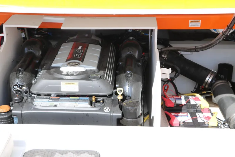 Slide: The Image of Engine compartment of 2022 Crownline 220 SS LPX boat, showcasing powerful engine and components. - 36