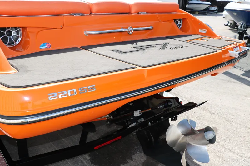 Slide: The Image of Orange 2022 Crownline 220 SS LPX boat rear view with propeller and branding. - 5