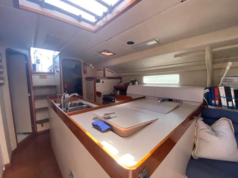 Slide: The Image of Interior of 1995 Sundeer 56 yacht with kitchen and seating area. - 14
