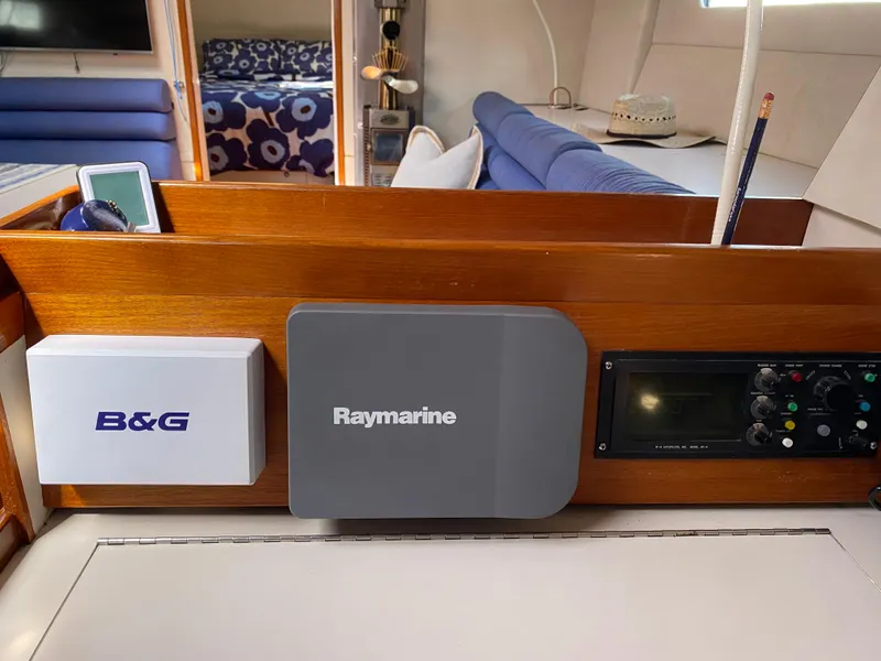 Slide: The Image of Navigation equipment on a 1995 Sundeer 56 yacht, featuring B&G and Raymarine systems. - 23
